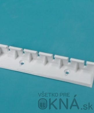 Držiak pre zaistenie klobúčikov plastový